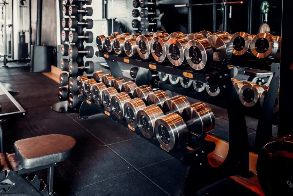 Dumbbell rack and bench across the BTX training floor