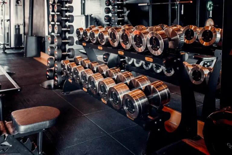 Dumbbell rack and bench across the BTX training floor